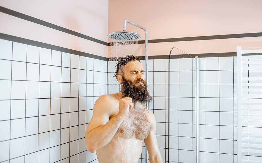 A man taking a cold shower