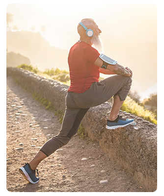 A man stretching and getting ready to run outside