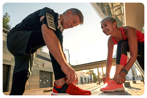 A couple getting ready to jog outside