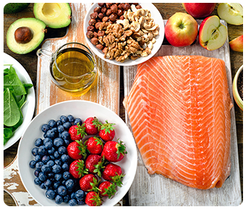 A cutting board with various healthy foods