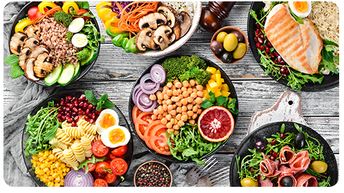 Various plates of food on a table