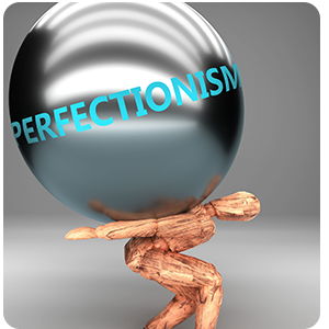 Wooden figure holding sphere on back with the word perfectionsim written on it