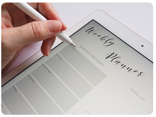A person writing in a tablet app weekly planner