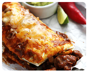 A smothered burrito on a plate
