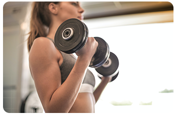 A woman exercising with dumbbells